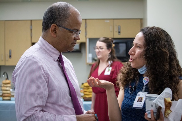 Kiame and Staff Chatting Kiame and Staff Chatting