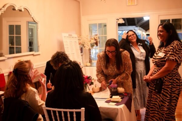 candid photo of people speaking during LCHC event