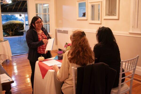 candid photo of people speaking during LCHC event