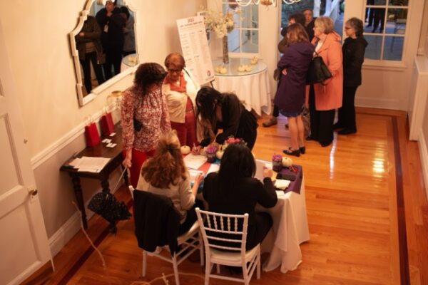 candid photo of people speaking during LCHC event