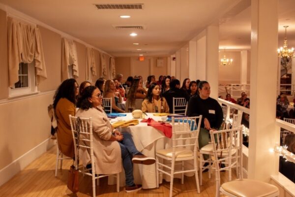 People sitting at tables for LCHC event