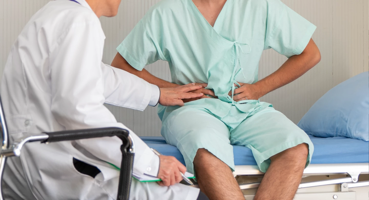 Lynn Community Health Center 2 Dr checking a patient complaining of pain in abdomen area