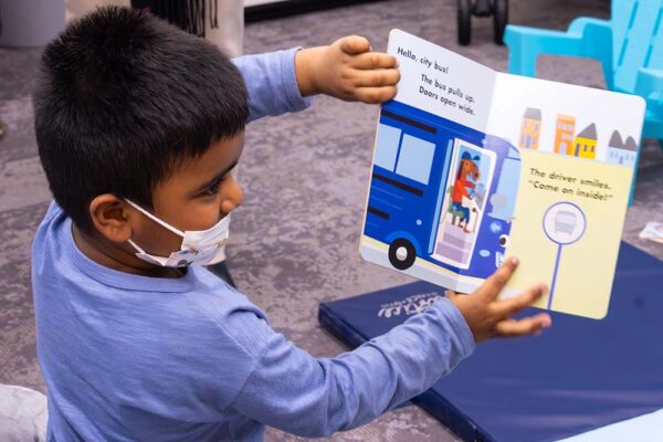Reach Out and Read - Kid with book