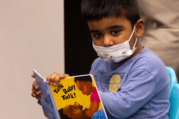 Reach Out and Read - Kid with book