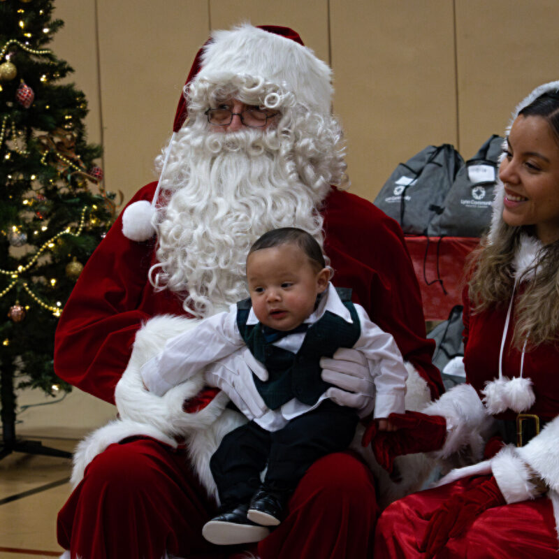 Santa with baby posing for pic